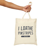 person holding tan canvas tote bag with the red sox phrase i loathe pinstripes by the red seat