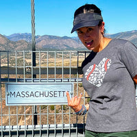 photo of woman wearing black women's t-shirt with design with heart shaped design with red sox fenway park designs