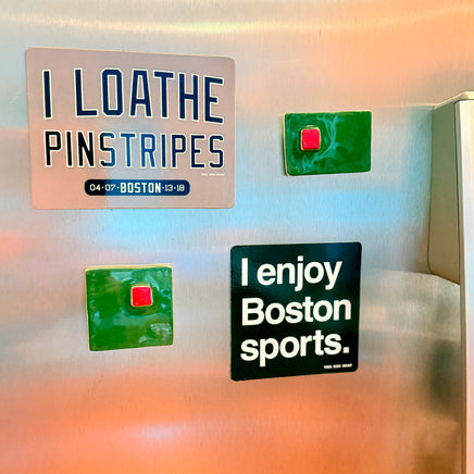 Fridge with magnets including 'I LOATHE PINSTRIPES' and 'I enjoy Boston sports.' from The Red Seat