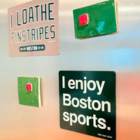 Fridge with decorative magnets including 'I loathe pinstripes' and 'I enjoy Boston sports.' from The Red Seat