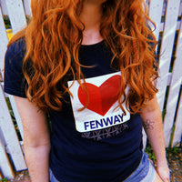 photo of woman wearing navy blue women's t-shirt with the boston fenway citgo sign in the shape of a heart