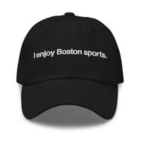 black baseball cap with "i enjoy boston sports" embroidered in white helvetica font