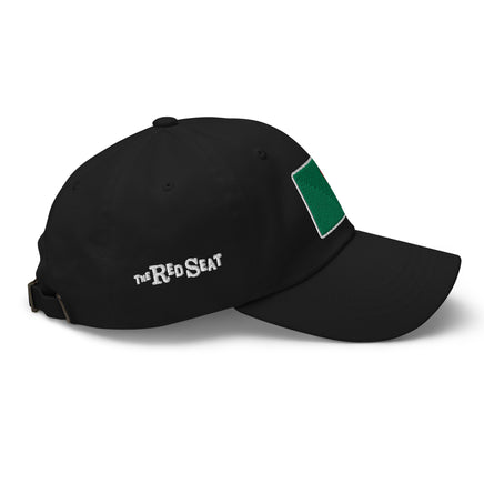 photo of a side view of a black baseball cap with fenway park's red seat embroidered on the front in green and red.