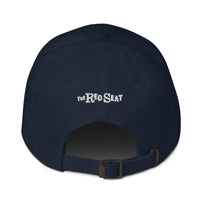 photo of the back of a baseball hat, with the brand The Red Seat embroidered on it.