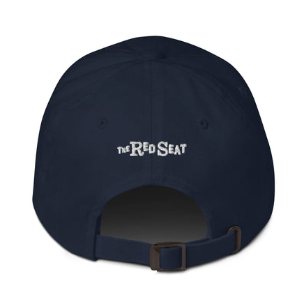photo of the back of a baseball hat, with the brand The Red Seat embroidered on it.