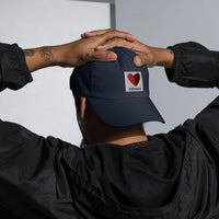 photo of man wearing graphic of the citgo sign boston fenway as a heart embroidered on baseball hat