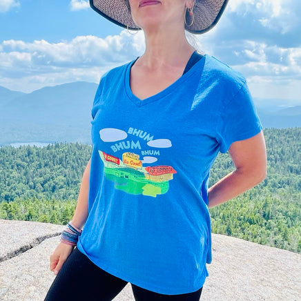 photo of woman wearing the red seat middle 8 design of fenway park on a blue women's v-neck t-shirt with sweet caroline so good.