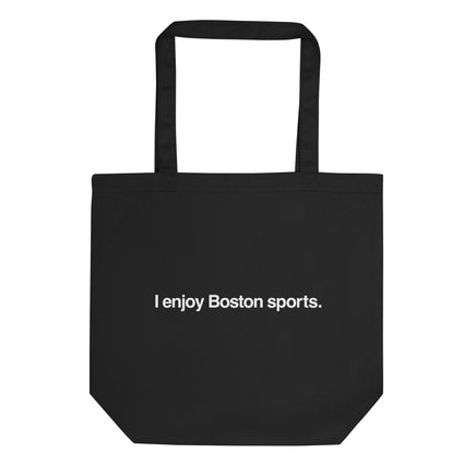 black tote bag with the words "i enjoy boston sports" written in white helvetica font