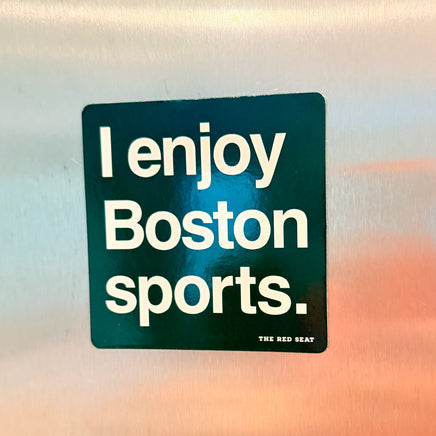 Refrigerator magnet with 'I enjoy Boston sports.' text on a reflective surface