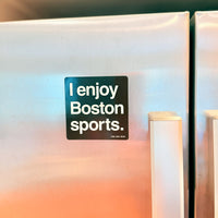 Fridge with a 'I enjoy Boston sports.' magnet on a blurred background