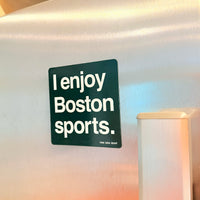 Refrigerator magnet with 'I enjoy Boston sports.' text on a reflective surface