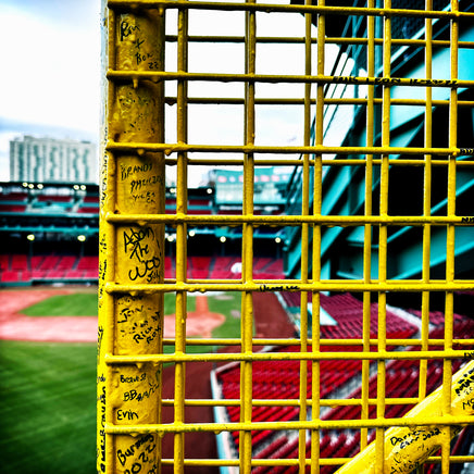 color photograph of fenway park through the yellow left field foul pole