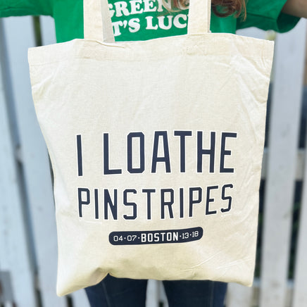 tan canvas tote bag with the red sox phrase i loathe pinstripes by the red seat