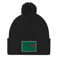 photo of a black pom pom beanie with the red seat logo in green and red embroidered on the cuff