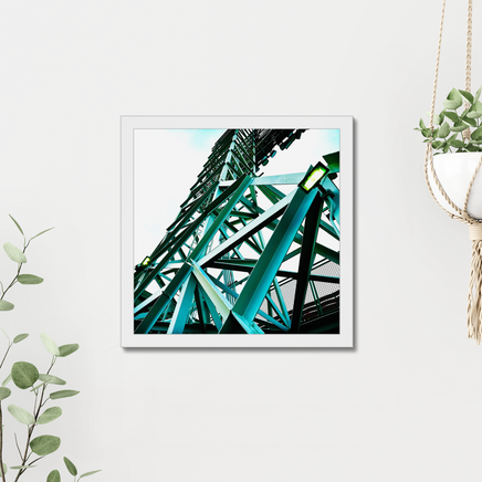 photograph of a boston red sox fenway park light tower looking up with green metal and a light sky, on a wall in a white frame