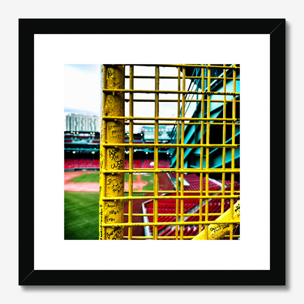 color photograph of fenway park through the yellow left field foul pole, in a black frame