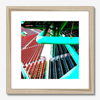photo of fenway parks left field grandstand and field boxes in red and blue with the green metal structure of the building, matted in a wood frame