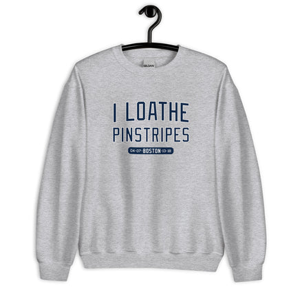 Gray sweatshirt with 'I Loathe Pinstripes' text on a hanger against a white background