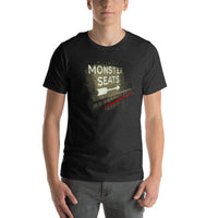 photograph of man wearing Monster Seats-The Red Seat Design with the words Green Monster Seats painted on a wall fenway on black unisex t-shirt park boston