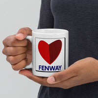 person holding white ceramic mug with the boston fenway citgo sign in the shape of a heart