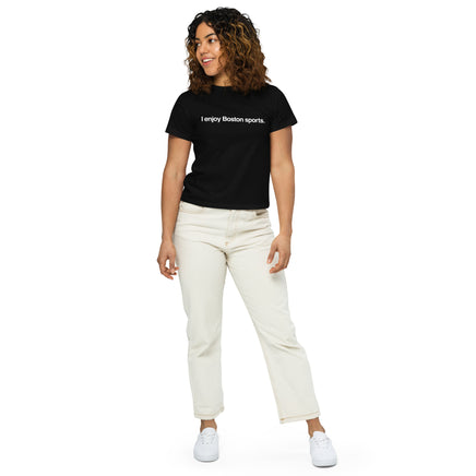 woman wearing women's black t-shirt with the words i enjoy boston sports in white simple text.
