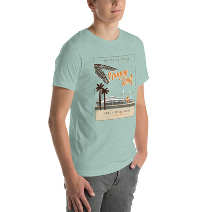 side view of man wearing unisex light green t-shirt with Mid Century modern design of JetBlue Park in Fort Myers at Sunset. Red Sox Spring Training.