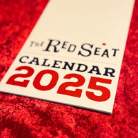 close up photo of cover of 2025 calendar from the red seat with full MLB red sox schedule