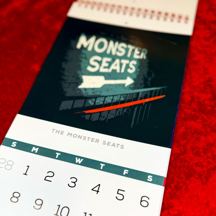 March 2027 page with an original Monster Seats sign illustration above the date grid