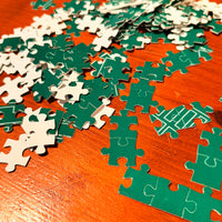 Jigsaw puzzle pieces on a wooden surface