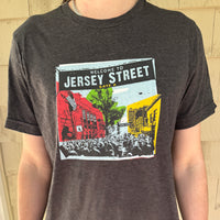 photo of man wearing dark grey t-shirt with boston red sox fenway park jersey street gate a design with blocks of color