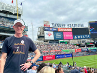 photograph of man wearing The Hall The Red Seat David Ortiz Boston Red Sox Cooperstown Hall of fame Elvis comeback special design on black unisex t-shirt in Yankee Stadium