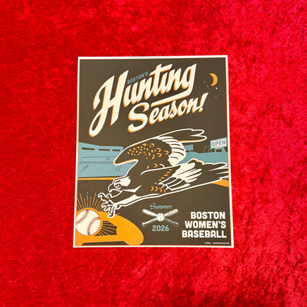 A rectangular printed poster or card reading 'Boston Hunting Season!' and 'Boston Women's Baseball Summer 2026,' featuring an eagle and baseball illustration, placed on a textured red fabric background.