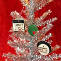 Decorative Christmas tree with 'I Enjoy Boston Sports' ornaments on a red background