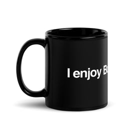 Photo of black glossy mug with the phrase i enjoy boston sports in white lettering