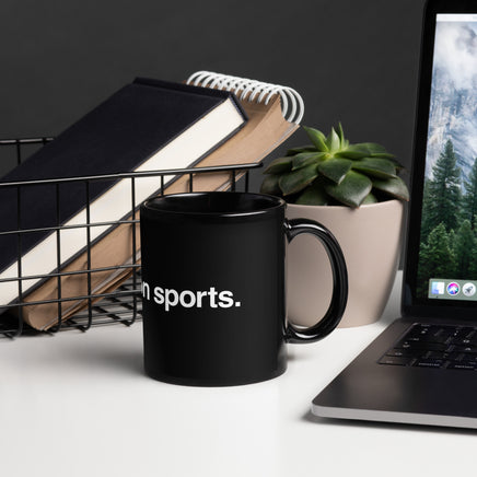 Photo of black glossy mug with the phrase i enjoy boston sports in white lettering