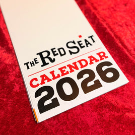 The Red Seat 2026 Calendar cover on red fabric background
