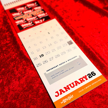 The Red Seat 2026 Calendar with January highlighted on a red textured background