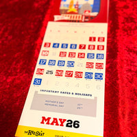 Calendar with May 26 highlighted on a red textured background