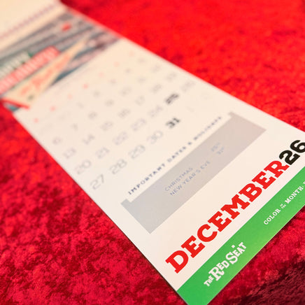 Calendar with 'December 26' on a red textured surface