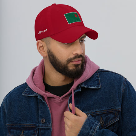 photo of a man wearing a red baseball cap with fenway park's red seat embroidered on the front in green and red.