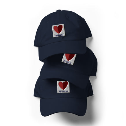 graphic of the citgo sign boston fenway as a heart embroidered on several stacked baseball hat