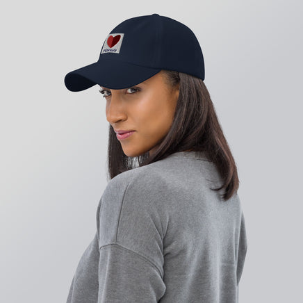graphic of the citgo sign boston fenway as a heart embroidered on baseball hat, woman wearing