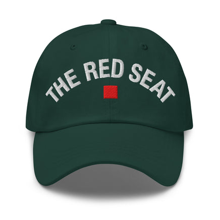 Front view of green dad cap with “The Red Seat” embroidered in white and red icon