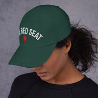 side view of Female Model wearing green Wordmark Edition hat