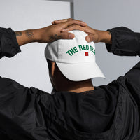 Male Model wearing white The Red Seat Wordmark Edition baseball cap backwards