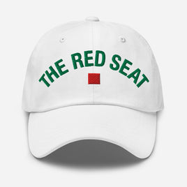 White cap with 'The Red Seat' text in green and a red square logo on a white background
