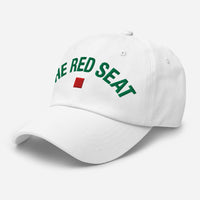 White cap with 'The Red Seat' text and flag logo on a white background