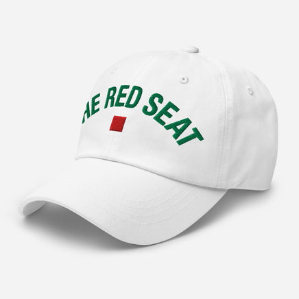 White cap with 'The Red Seat' text and flag logo on a white background