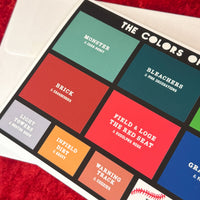 photo of the red seat colors of fenway holiday card with different blocks of color representing different areas of fenway park and the holiday season