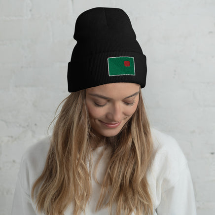 photo of a woman wearing black beanie with the red seat logo in green and red embroidered on the cuff